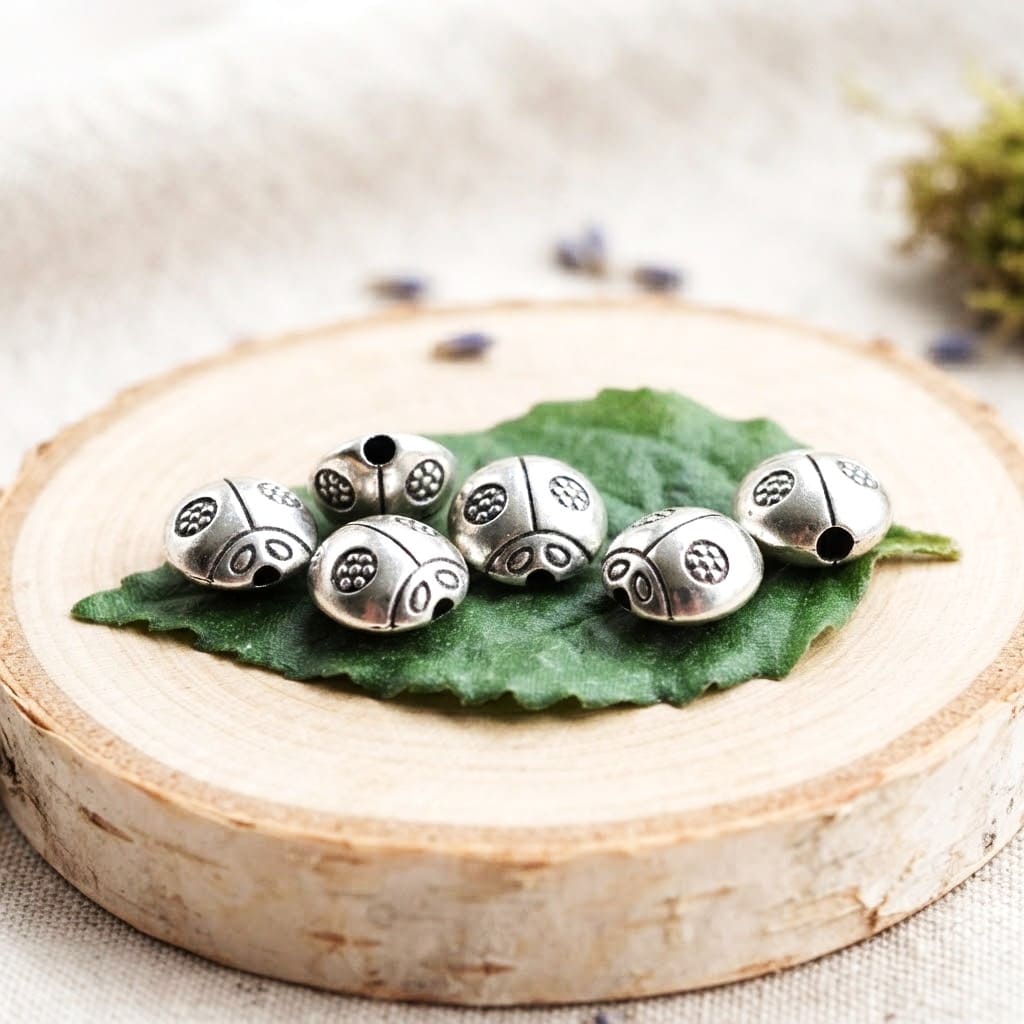 Perles coccinelles en métal argent vieilli 9*9 mm par 10